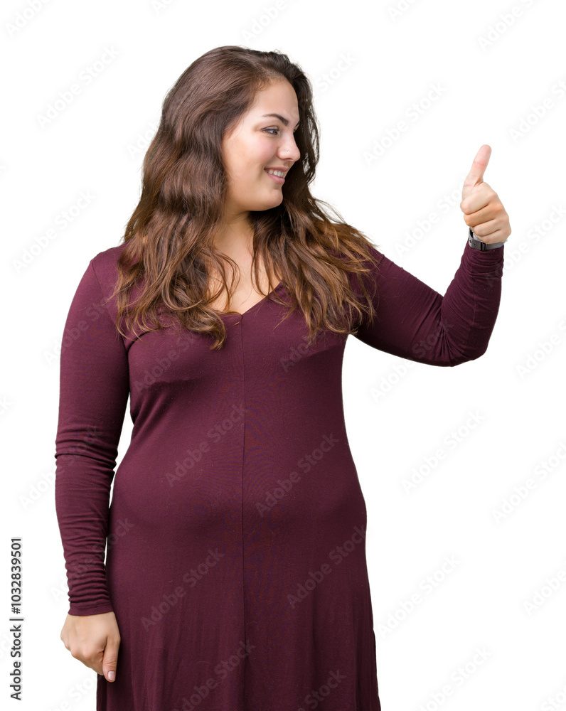 Beautiful and attractive plus size young woman wearing a dress over isolated background Looking proud, smiling doing thumbs up gesture to the side Beautiful and attractive plus size young woman wearing a dress over isolated background Looking proud, smiling doing thumbs up gesture to the side