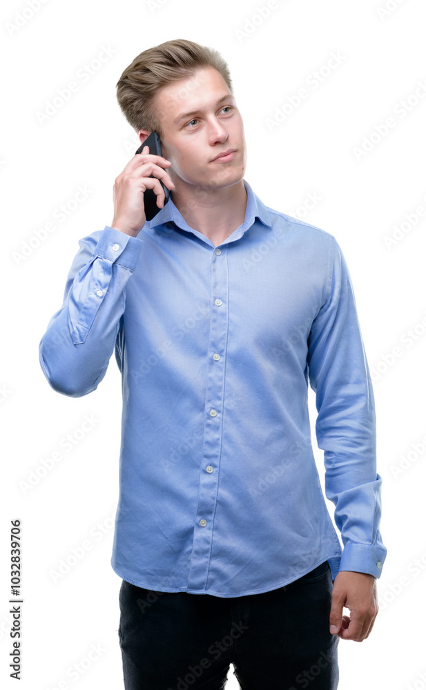 Young handsome blond man using smartphone serious face thinking about question, very confused idea Young handsome blond man using smartphone serious face thinking about question, very confused idea