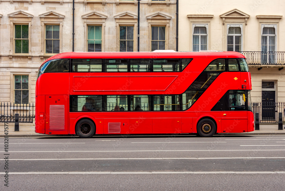 Red double-decker bus on streets of London, UK