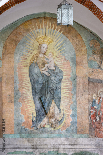 The Virgin Mary with Infant Jesus in Glory. A mural fresco in the Franciscan Friary near the Basilica of St Francis of Assisi in Kraków, Poland.