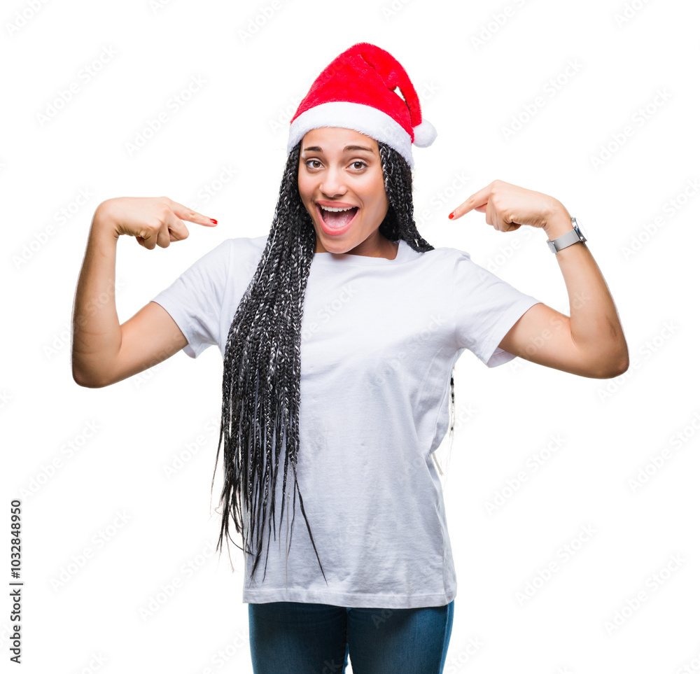 Young braided hair african american girl wearing christmas hat over isolated background looking confident with smile on face, pointing oneself with fingers proud and happy. Young braided hair african american girl wearing christmas hat over isolated background looking confident with smile on face, pointing oneself with fingers proud and happy.
