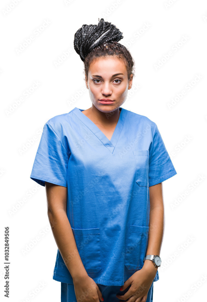 Young braided hair african american girl professional nurse over isolated background with serious expression on face. Simple and natural looking at the camera. Young braided hair african american girl professional nurse over isolated background with serious expression on face. Simple and natural looking at the camera.