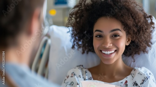 Young happy woman smiling while lying in hospital bed with space for text or inscriptions, get well soon or get well soon photo