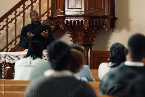 Photos Pastor delivering sunday sermon from church pulpit