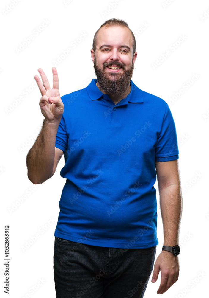Young caucasian hipster man wearing blue shirt over isolated background showing and pointing up with fingers number three while smiling confident and happy. Young caucasian hipster man wearing blue shirt over isolated background showing and pointing up with fingers number three while smiling confident and happy.