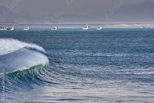 Chicama is famous for being home to one of the longest left-hand waves in the world. It is a renowned surf spot located in northern Peru, near the town of Puerto Malabrigo, in the La Libertad region photo