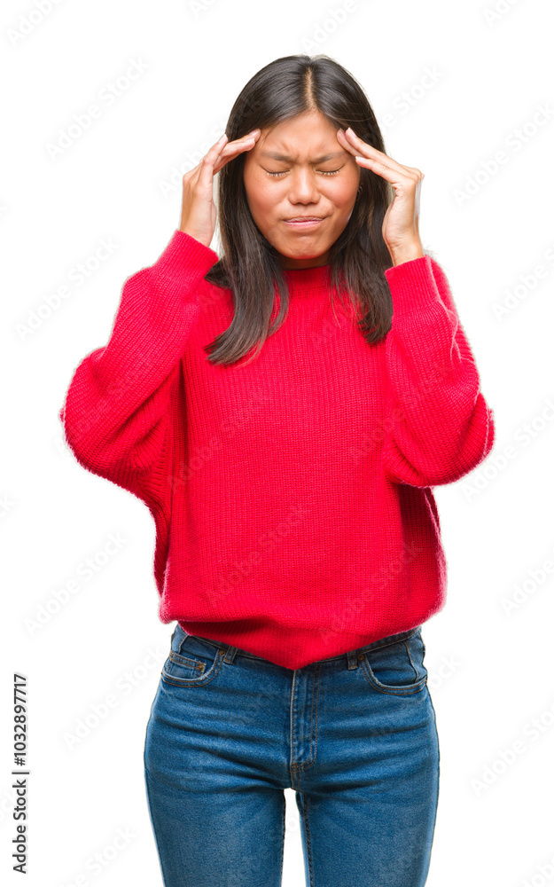 Young asian woman wearing winter sweater over isolated background with hand on head for pain in head because stress. Suffering migraine. Young asian woman wearing winter sweater over isolated background with hand on head for pain in head because stress. Suffering migraine.