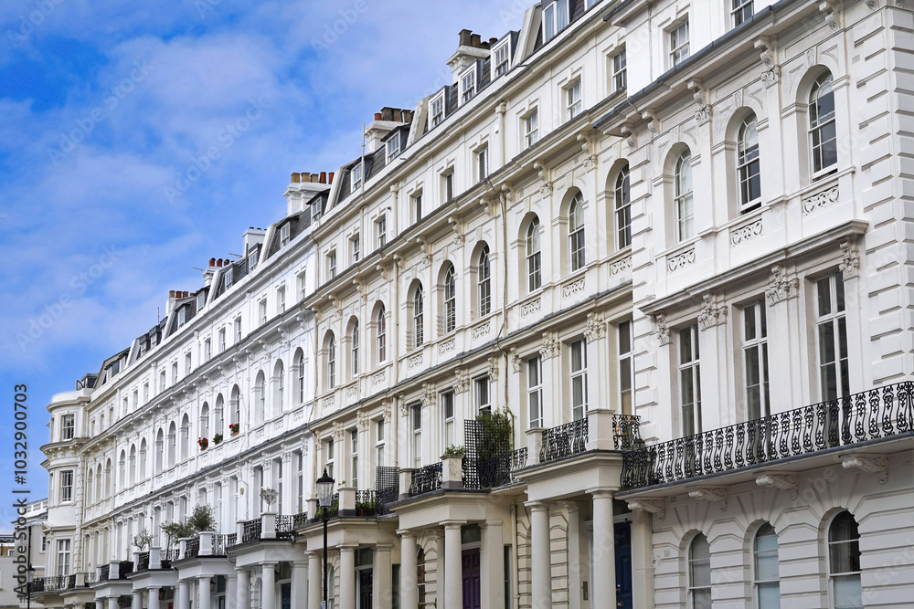 Street of elegant white townhouses in London Street of elegant white townhouses in London