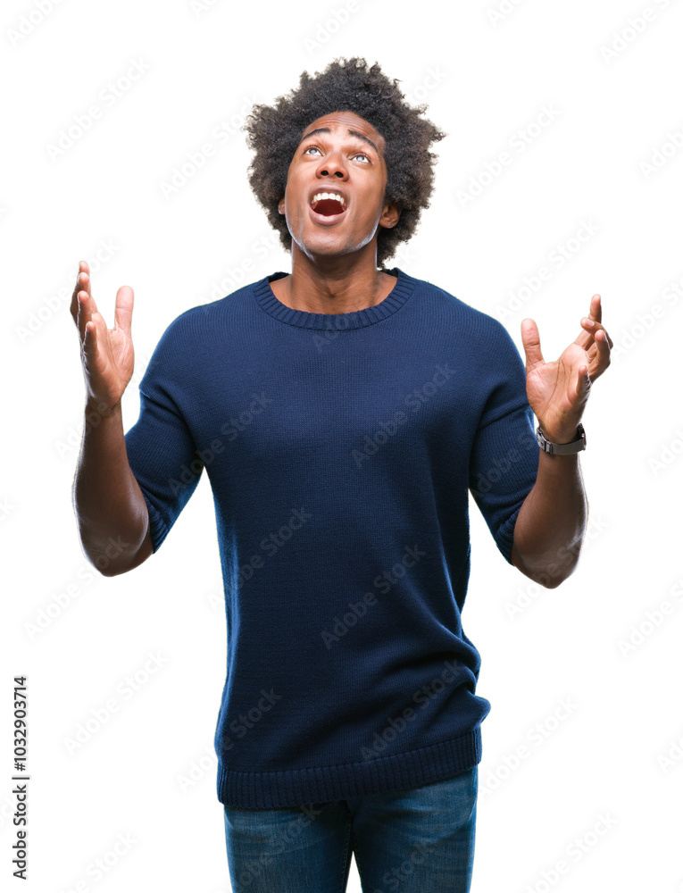 Afro american man over isolated background crazy and mad shouting and yelling with aggressive expression and arms raised. Frustration concept. Afro american man over isolated background crazy and mad shouting and yelling with aggressive expression and arms raised. Frustration concept.