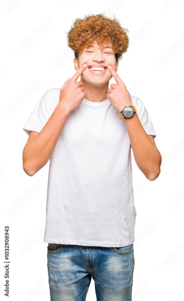 Young handsome man with afro hair wearing casual white t-shirt Smiling with open mouth, fingers pointing and forcing cheerful smile Young handsome man with afro hair wearing casual white t-shirt Smiling with open mouth, fingers pointing and forcing cheerful smile