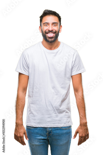 Adult hispanic man over isolated background sticking tongue out happy with funny expression. Emotion concept.