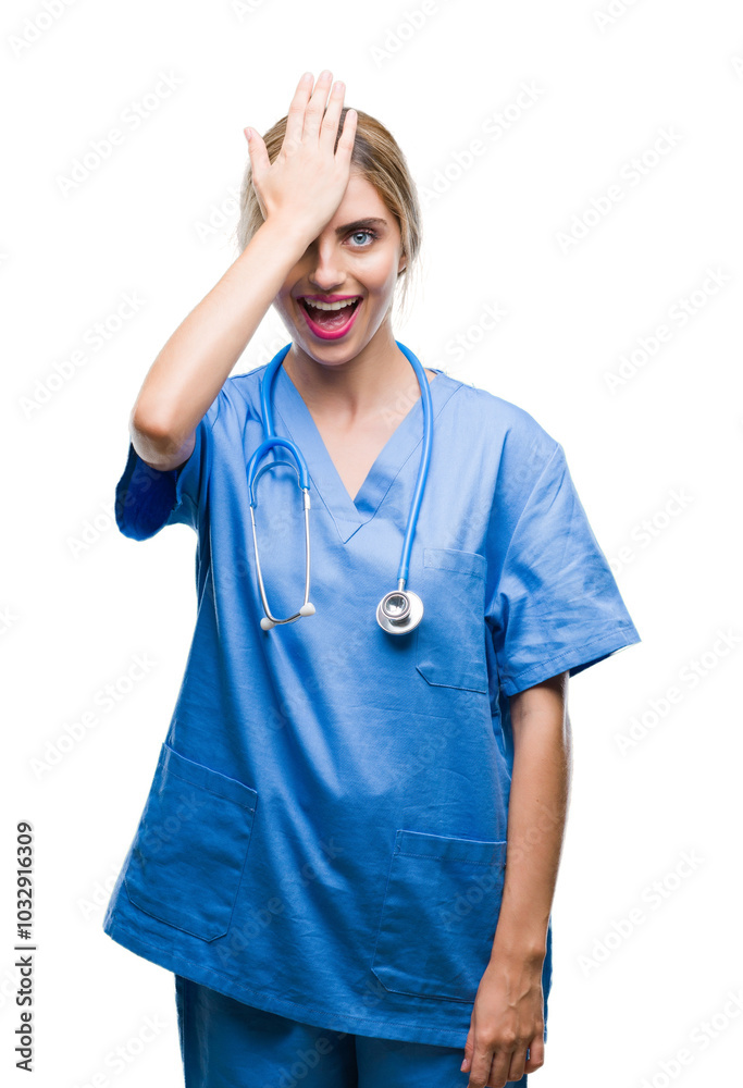 Young beautiful blonde doctor surgeon nurse woman over isolated background surprised with hand on head for mistake, remember error. Forgot, bad memory concept. Young beautiful blonde doctor surgeon nurse woman over isolated background surprised with hand on head for mistake, remember error. Forgot, bad memory concept.