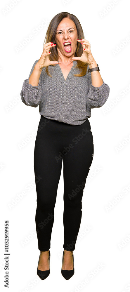 Beautiful middle age business woman Shouting frustrated with rage, hands trying to strangle, yelling mad