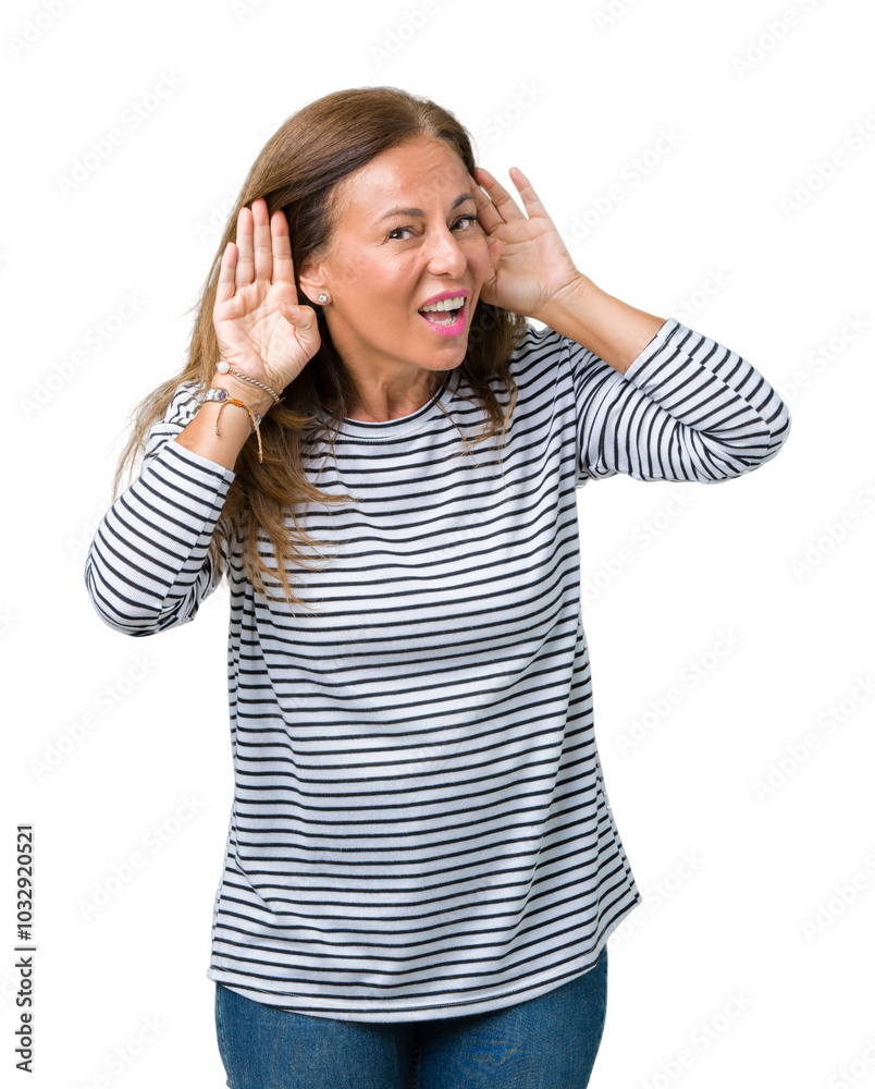Beautiful middle age woman wearing stripes sweater over isolated background Trying to hear both hands on ear gesture, curious for gossip. Hearing problem, deaf Beautiful middle age woman wearing stripes sweater over isolated background Trying to hear both hands on ear gesture, curious for gossip. Hearing problem, deaf