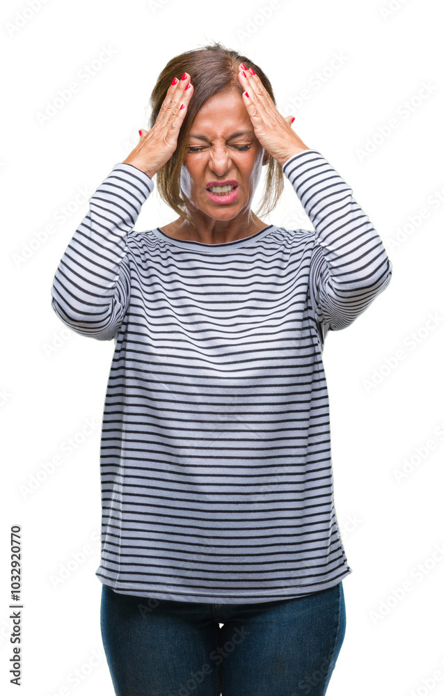 Middle age senior hispanic woman over isolated background suffering from headache desperate and stressed because pain and migraine. Hands on head. Middle age senior hispanic woman over isolated background suffering from headache desperate and stressed because pain and migraine. Hands on head.