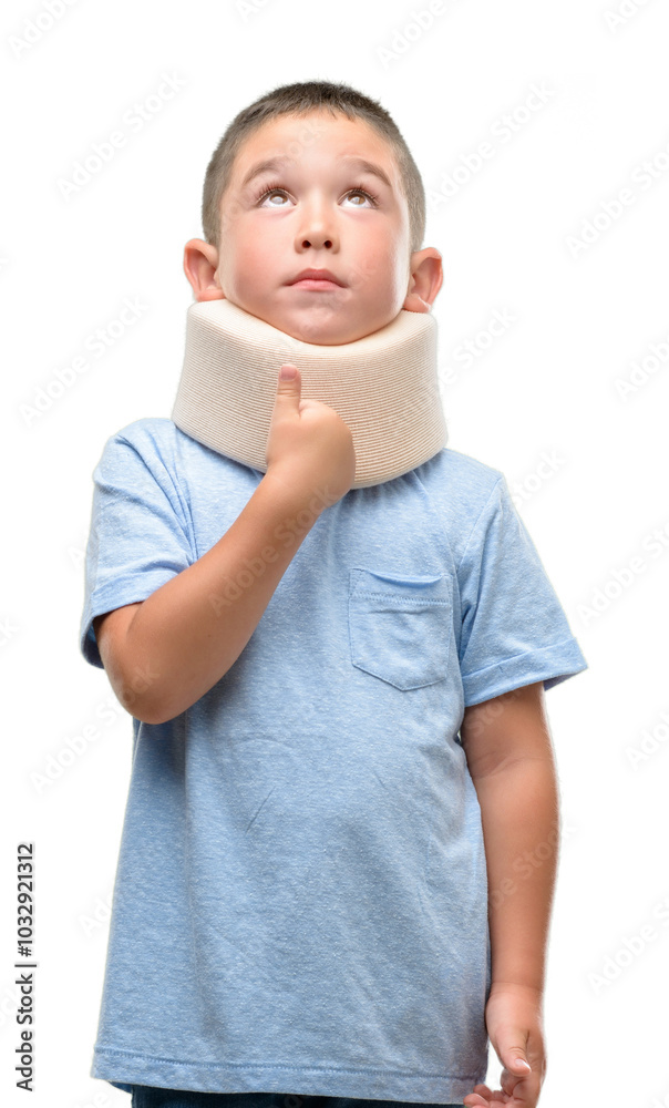 Dark haired little child injured wearing neck collar serious face thinking about question, very confused idea Dark haired little child injured wearing neck collar serious face thinking about question, very confused idea
