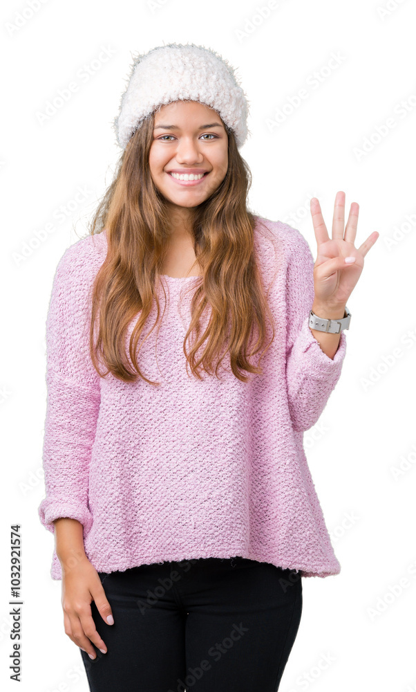 Young beautiful brunette woman wearing sweater and winter hat over isolated background showing and pointing up with fingers number four while smiling confident and happy. Young beautiful brunette woman wearing sweater and winter hat over isolated background showing and pointing up with fingers number four while smiling confident and happy.