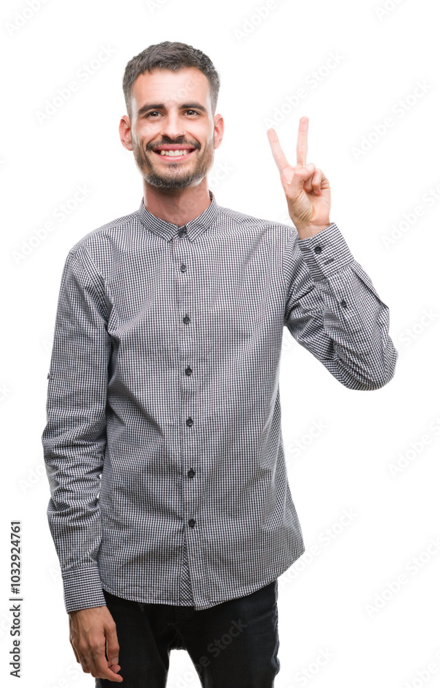 Young hipster man showing and pointing up with fingers number two while smiling confident and happy. Young hipster man showing and pointing up with fingers number two while smiling confident and happy.