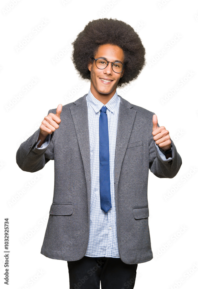 Young african american business man with afro hair wearing glasses approving doing positive gesture with hand, thumbs up smiling and happy for success. Looking at the camera, winner gesture. Young african american business man with afro hair wearing glasses approving doing positive gesture with hand, thumbs up smiling and happy for success. Looking at the camera, winner gesture.