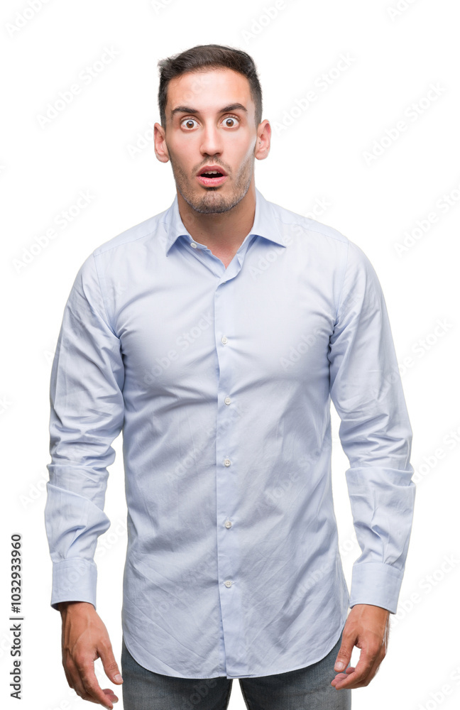 Handsome young businessman afraid and shocked with surprise expression, fear and excited face. Handsome young businessman afraid and shocked with surprise expression, fear and excited face.