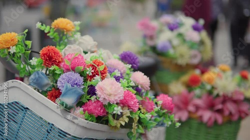 a bunch of flowers on a basket, at garden in Sunny day in Marba Building in Old City Area of Kota Lama. Full of tourist and travel destination in Semarang.