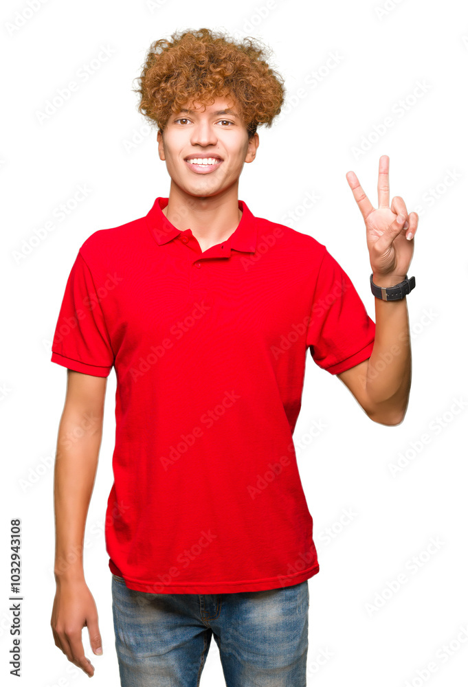 Young handsome man with afro hair wearing red t-shirt showing and pointing up with fingers number two while smiling confident and happy. Young handsome man with afro hair wearing red t-shirt showing and pointing up with fingers number two while smiling confident and happy.