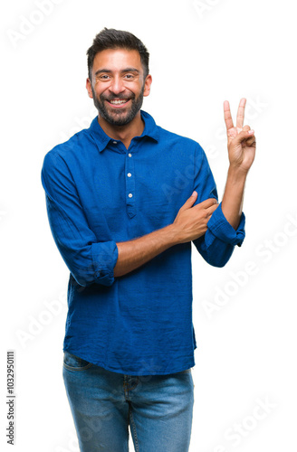 Adult hispanic man over isolated background smiling with happy face winking at the camera doing victory sign. Number two.