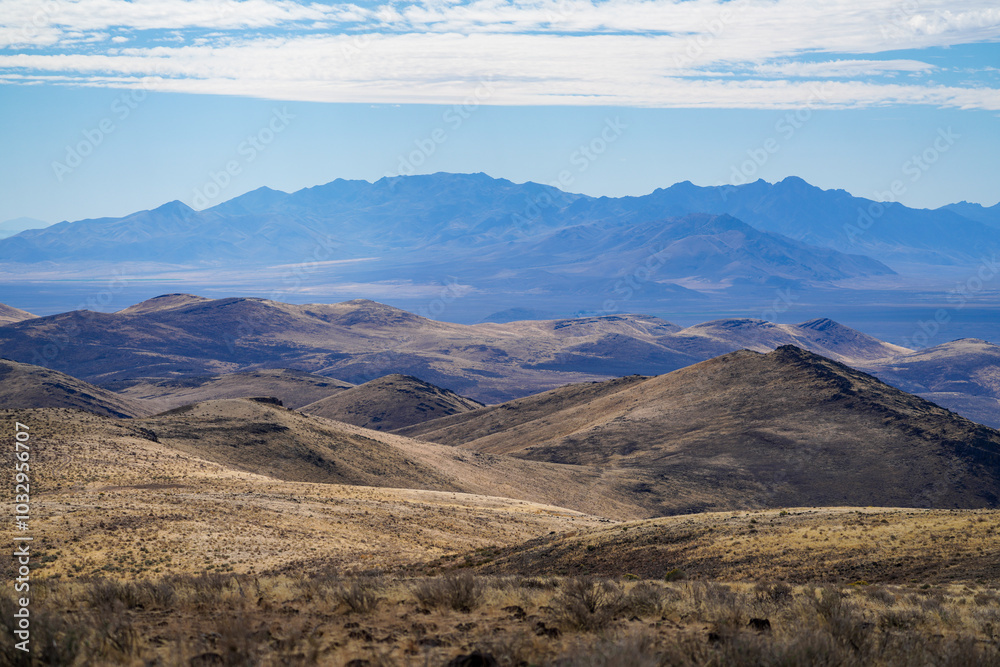 Arid dry Nevada Mountain Landscape with a few clouds. Arid dry Nevada Mountain Landscape with a few clouds.