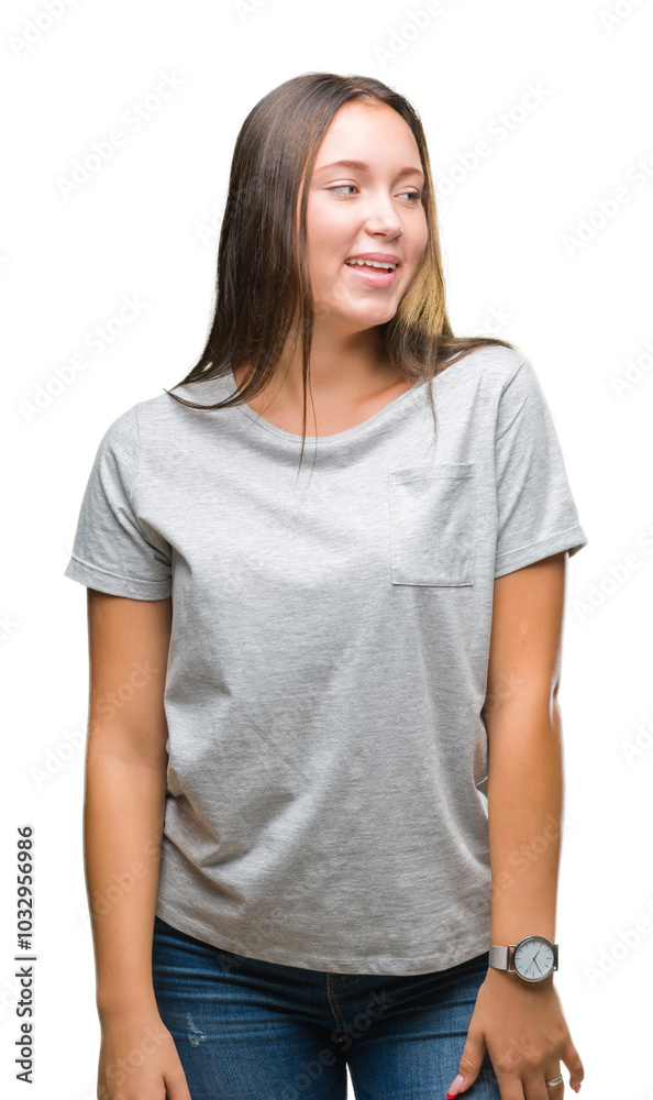 Young caucasian beautiful woman over isolated background looking away to side with smile on face, natural expression. Laughing confident. Young caucasian beautiful woman over isolated background looking away to side with smile on face, natural expression. Laughing confident.
