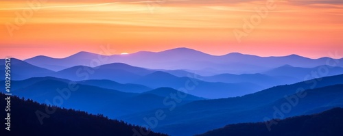 Mountain range at sunrise with colorful sky, serene landscape concept