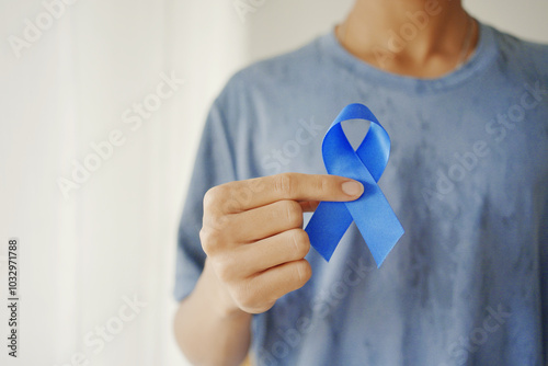 Bild auf Leinwand Hands holding blue ribbon, Prostate cancer awareness, November blue, men health