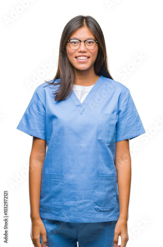 Young asian doctor woman over isolated background with a happy and cool smile on face. Lucky person.