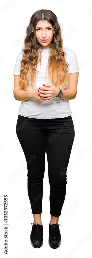 Obraz premium Young beautiful woman wearing casual white t-shirt Hands together and fingers crossed smiling relaxed and cheerful. Success and optimistic