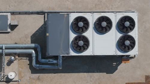 air conditioning industrial in top of a building roof, ac unit and pipe tubes with ventilation fans