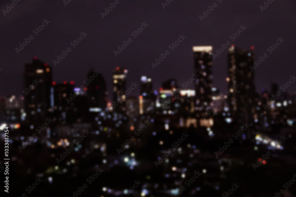 Obraz premium Blurred photo of skyscrapers in Bangkok cityscape at twilight time.