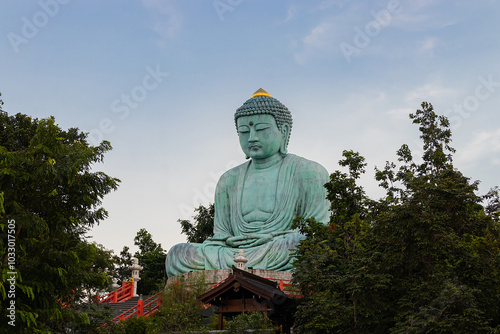 Great Buddha or Kamakura Daibutsu statue at sunset time in Wat Phra That Doi Phra Chan temple, Lampang, Thailand.