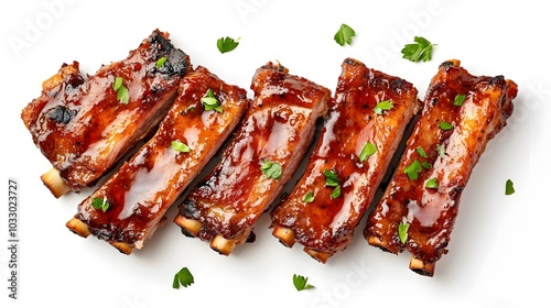Delicious grilled pork ribs in BBQ sauce with herbs, isolated on white background. 