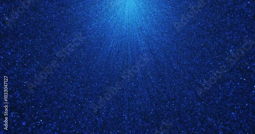 Intense data stream effect with dense blue particles radiating from a central light source. The particle flow creates a futuristic, digital visual, resembling high tech data transfer or energy burst.