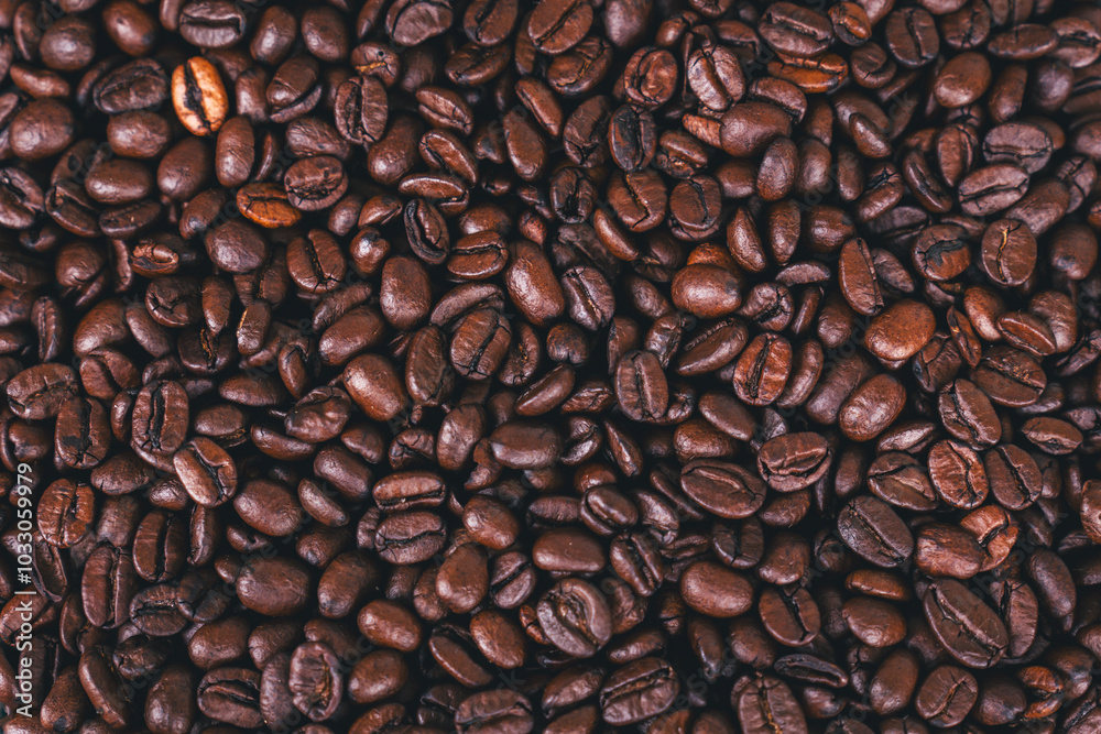 Naklejka premium Roasted coffee beans background