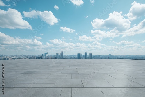 A wide shot of a city skyline with a large, empty concrete space in the foreground.