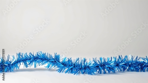 blue christmas garland on a white background for holiday decor