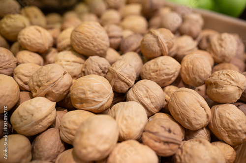 Pile of walnuts in market, product rich in minerals and vitamins