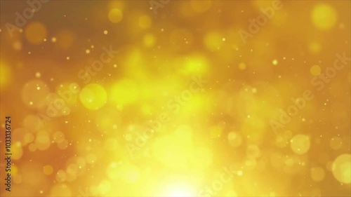 Abstract gold bokeh background with blurry lights and shining particles.