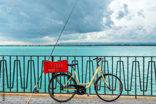 Bicycle and fishing rod. Syracuse, Sicily, Italy