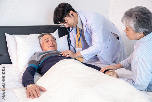 old man end stage patient on bed,on IV drip,worried wife sit beside,doctor physically examine,home care,chronic care,breaking bad news,communication photo