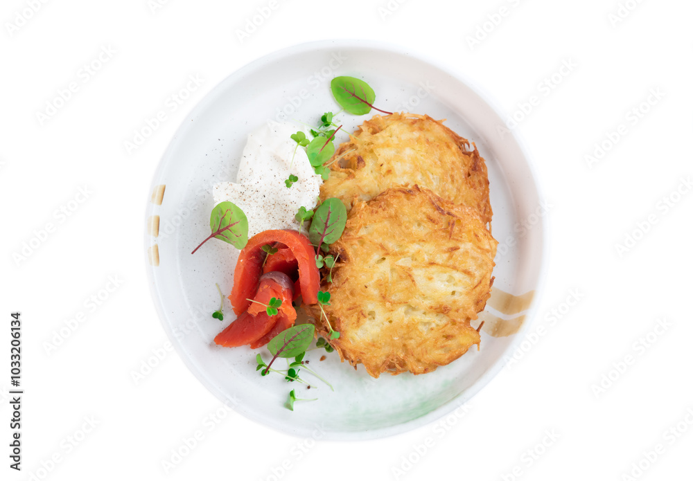 Russian and Belarus draniki or potato pancakes wish sour cream and smoked salmon Russian and Belarus draniki or potato pancakes wish sour cream and smoked salmon