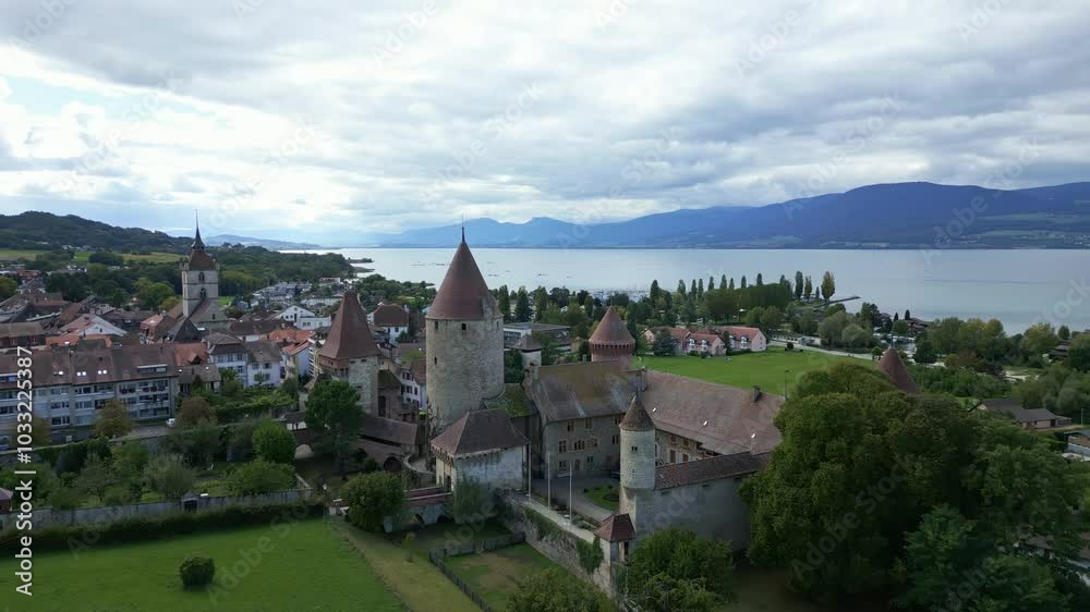 Push in drone shot of Chenaux Castle in Estavayer-le-Lac with Lake Neuchatel in Fribourg Switzerland Push in drone shot of Chenaux Castle in Estavayer-le-Lac with Lake Neuchatel in Fribourg Switzerland