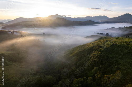 Landscape of Morning Mist with Mountain Layer at north of Thailand. mountain ridge and clouds in rural jungle bush forest