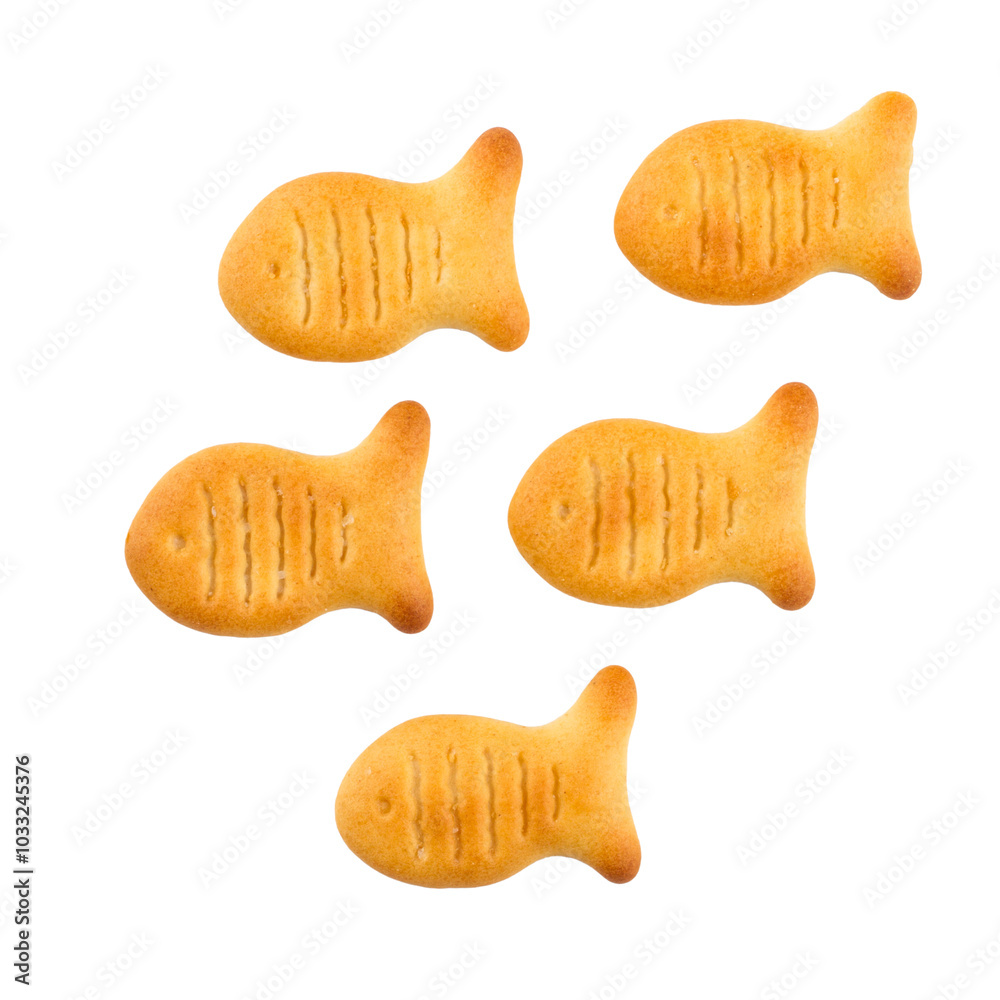 Fish-shaped cracker cookies on a white background. Crispy crackers isolated. Fish-shaped cracker cookies on a white background. Crispy crackers isolated.