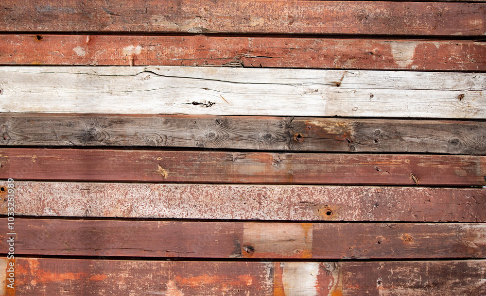 The image is a close up of a wooden wall with a red and white stripe The image is a close up of a wooden wall with a red and white stripe